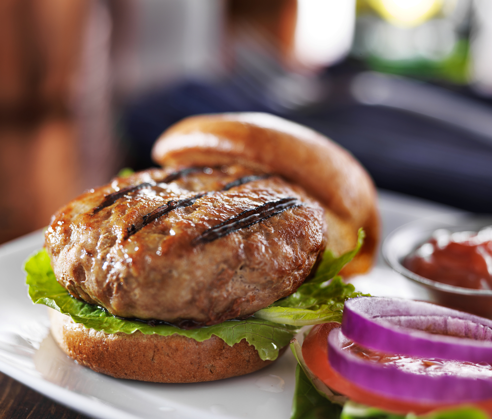 Turkey Burger on a bun with salad